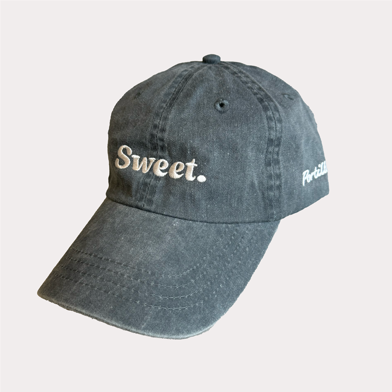 Hat with the word &quot;Sweet&quot; on it.